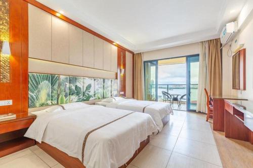 Ένα ή περισσότερα κρεβάτια σε δωμάτιο στο Mango Sea View Hotel