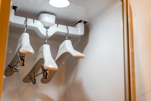 a group of white lights hanging from a wall at Seven Motel Ansan in Ansan