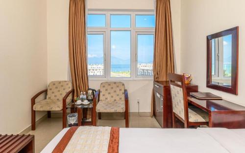 Ένα ή περισσότερα κρεβάτια σε δωμάτιο στο Ocean View Danang Hotel