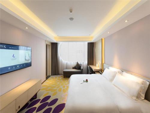 Ένα ή περισσότερα κρεβάτια σε δωμάτιο στο Lavande Hotel Deyang Guanghan