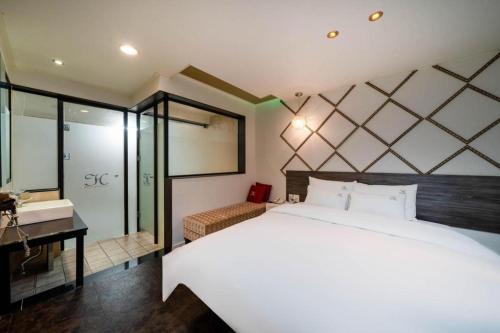 Postel nebo postele na pokoji v ubytování Gimhae Jangyu HUEN Hotel
