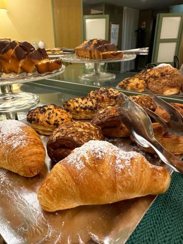 a bunch of pastries sitting on a table at Hotel La Goletta in Binasco