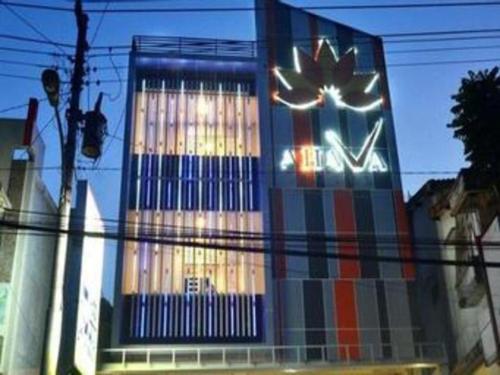 a building with a sign on the side of it at Hotel Ahava in Magelang