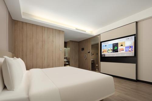 Μια τηλεόραση ή/και κέντρο ψυχαγωγίας στο Atour Hotel Suzhou Jinji Lake Ligongdi