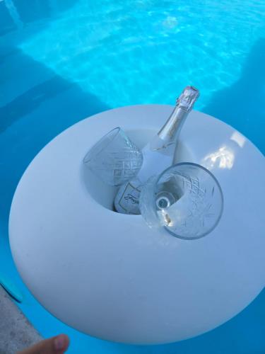 a glass bottle sitting in a swimming pool at Villa Heaven Green in Pazin
