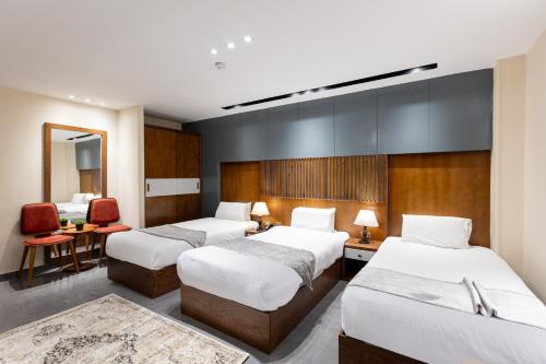Ένα ή περισσότερα κρεβάτια σε δωμάτιο στο Pyramids Yard Hotel
