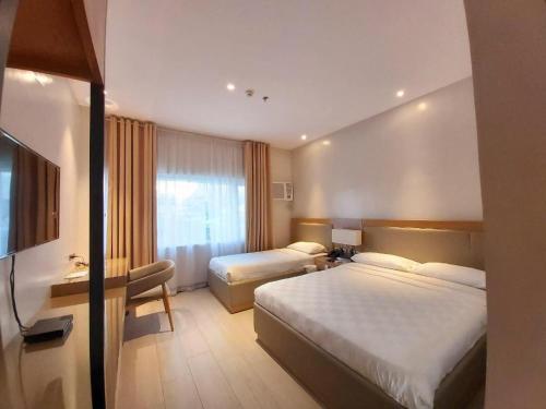 Кровать или кровати в номере Avenue Suites