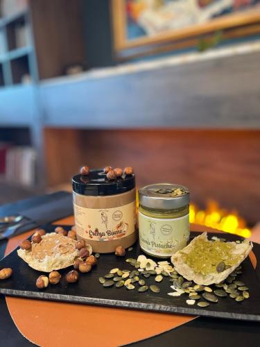 two containers of food sitting on a tray next to a fire at Best Western Plus Le Conquerant Rouen Nord in Bois-Guillaume