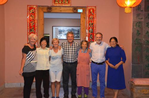 a group of people posing for a picture at Riverside Retreat Hotel in Yangshuo