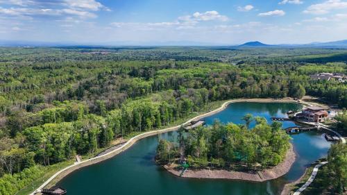 an aerial view of a lake in the woods at Hyatt Regency Changbaishan in Fusong