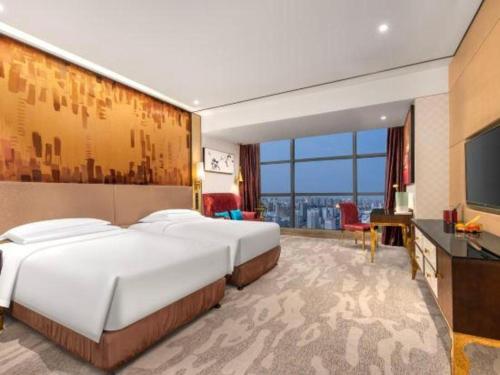 Postel nebo postele na pokoji v ubytování Shijiazhuang Ximeijin Continental Hotel