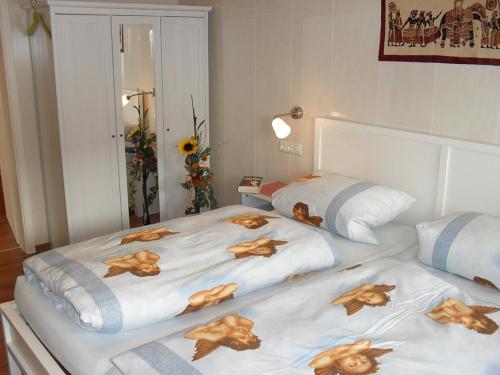 a bedroom with two beds with dogs on them at Ferienwohnung Ambrosia in Bad Birnbach