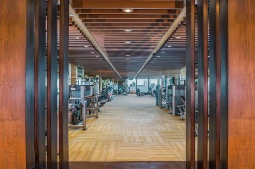 an empty room with wooden walls and wooden flooring at The St. Regis Mumbai in Mumbai