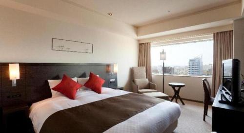 Un ou plusieurs lits dans un hébergement de l'établissement Century Royal Hotel Sapporo