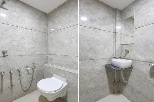 a bathroom with a toilet and a shower at FabHotel SS - Opp Vishwakarma Engineering College in Ahmedabad