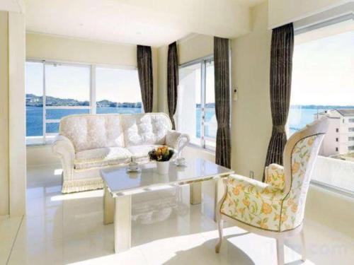 a living room with a couch and a table at Hamanako Lake Side Plaza in Hamamatsu