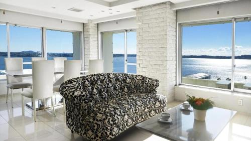 a living room with a couch and a table at Hamanako Lake Side Plaza in Hamamatsu