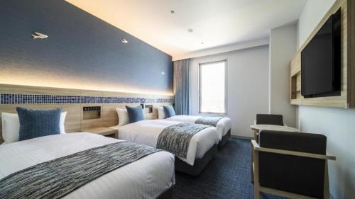 Goto Tsubaki Hotelにあるベッド