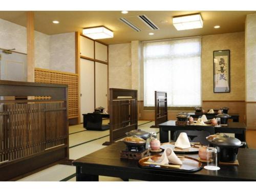a large room with tables with food on them at Ako Park Hotel in Ako