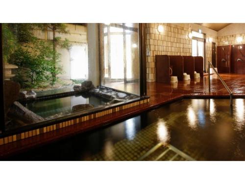 a large pool of water in a large room at Ako Park Hotel in Ako