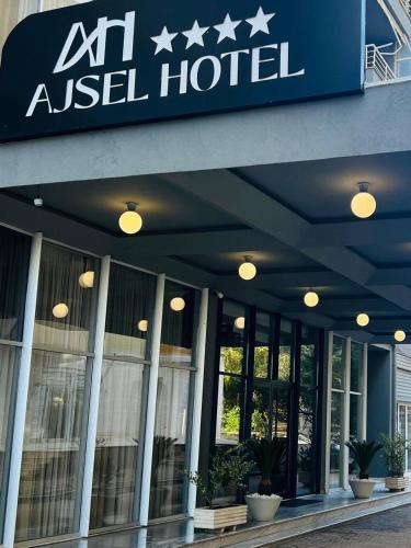 ananas used hotel sign on the side of a building at Ajsel Hotel in Durrës