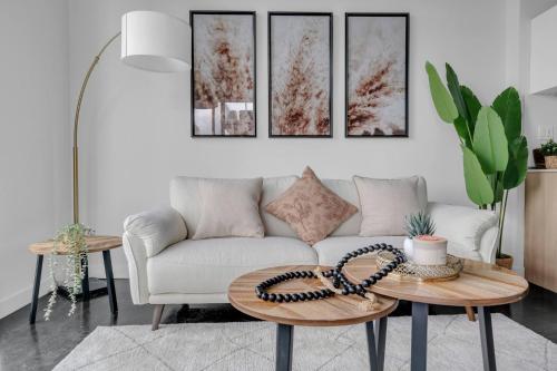 a living room with a couch and a table at Stylish Beltline 1BR w/ Parking in Calgary