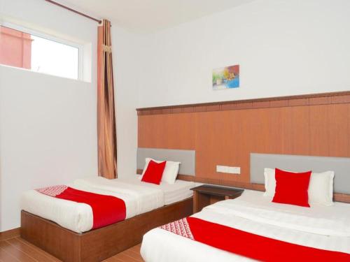 Кровать или кровати в номере OYO 89457 682 Lodge