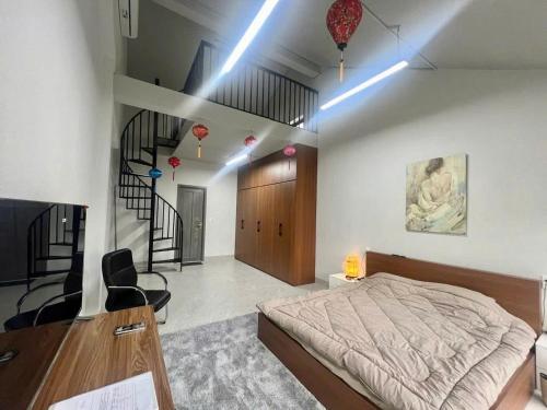 a bedroom with a bed and a staircase at Casamia Calm Houses, ốc đảo yên bình giữa lòng Hội An in An Bang