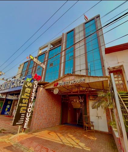 a building with a sign in front of it at AP GUEST HOUSE by TWC in Bhubaneshwar