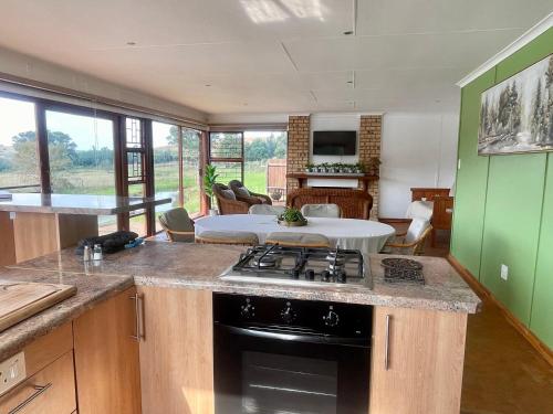 a kitchen with a stove and a counter top at Galil Farm in Crossroads