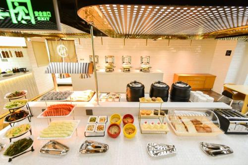 a buffet table with many different types of food at Atour Hotel Beijing West Railway Station South Square in Beijing