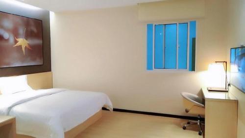 Postel nebo postele na pokoji v ubytování IU Hotels·Tongling Beidouxingcheng