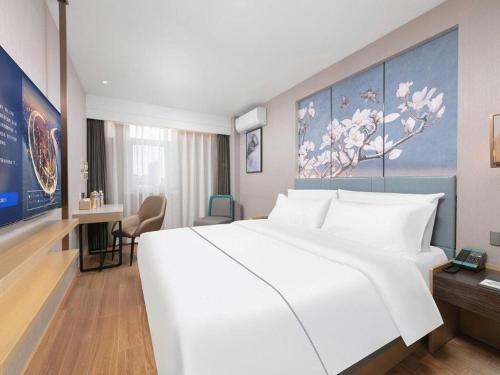 Ένα ή περισσότερα κρεβάτια σε δωμάτιο στο Magnotel Classic Shenyang General Hospital of Northern Theater Command