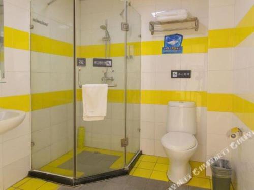 a bathroom with a shower with a toilet and a sink at 7 Days Inn Changzhou Yancheng Technology Metro Station in Changzhou
