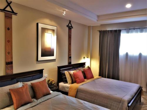 Postel nebo postele na pokoji v ubytování Phu View Hideaway