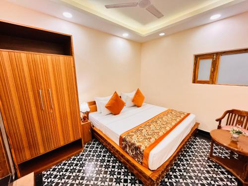 Ένα ή περισσότερα κρεβάτια σε δωμάτιο στο Hotel Green Galaxy - Green Park South Delhi