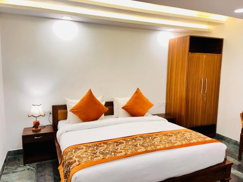Ένα ή περισσότερα κρεβάτια σε δωμάτιο στο Hotel Green Galaxy - Green Park South Delhi
