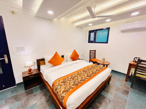 Ένα ή περισσότερα κρεβάτια σε δωμάτιο στο Hotel Green Galaxy - Green Park South Delhi