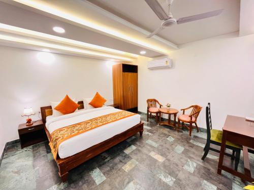 Ένα ή περισσότερα κρεβάτια σε δωμάτιο στο Hotel Green Galaxy - Green Park South Delhi