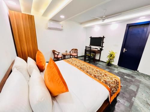 Ένα ή περισσότερα κρεβάτια σε δωμάτιο στο Hotel Green Galaxy - Green Park South Delhi