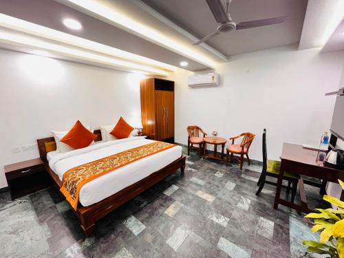 Ένα ή περισσότερα κρεβάτια σε δωμάτιο στο Hotel Green Galaxy - Green Park South Delhi