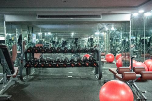a gym filled with lots of racks of red balls at Gorash Hotel in Khamis Mushayt