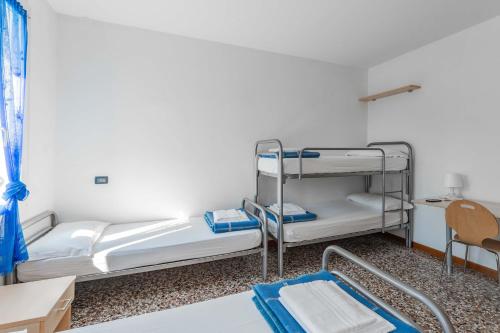Postel nebo postele na pokoji v ubytování Ostello Bassano Del Grappa