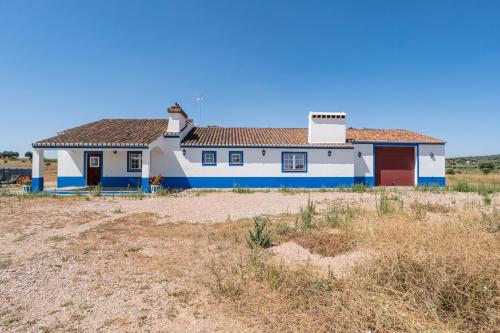 a house with blue and white paint on it at Quinta do Mocho by Portus Alacer in Arcos