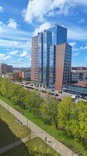a view of a city with tall buildings at Apartamentai prie Akropolio gražiu vaizdu į miesta in Klaipėda