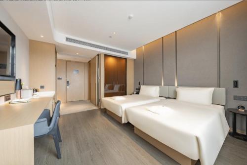 Katil atau katil-katil dalam bilik di Atour Hotel Shanghai Pudong Airport Chuansha Station