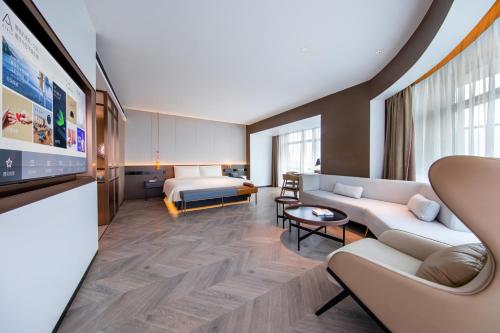 a hotel room with two beds and a tv at Atour S Hotel Beijing Daxing International Airport in Daxing