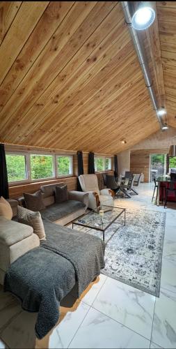 Posezení v ubytování Gîte cosy au cœur de la nature