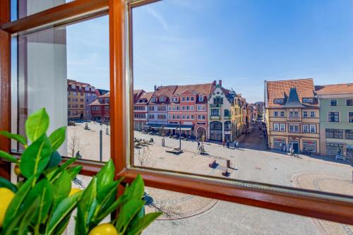 a view of a city from a window at CozyHome Hauptmarkt Apartments in Gotha