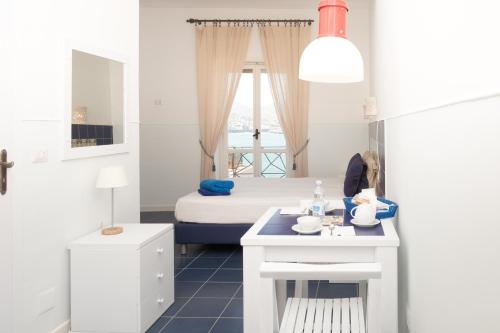 Postel nebo postele na pokoji v ubytování Residenza Punta Stendardo